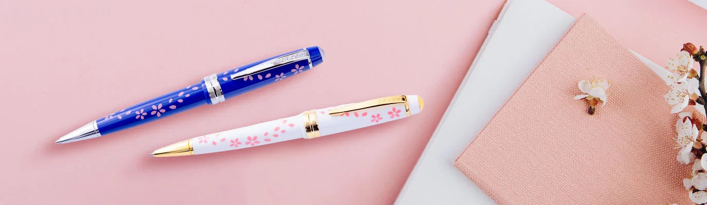 Blue and white Bailey Light Cherry Blossom pens displayed side by side on a tabletop.