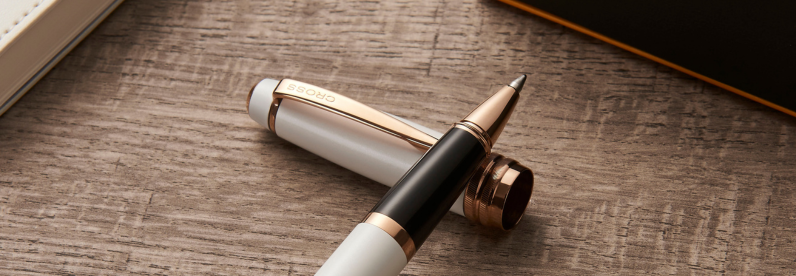 Bailey Pearlescent White Lacquer Rollerball Pen uncapped, resting on its cap.