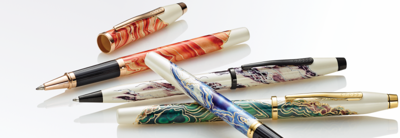 Wanderlust Collection pens—Borneo, Malta, Everest, and Antelope Canyon—spread out and stacked on a white background.